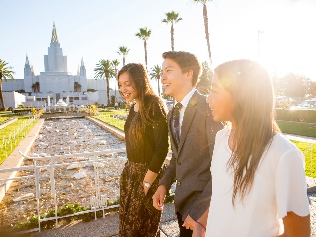 family walking outside temple